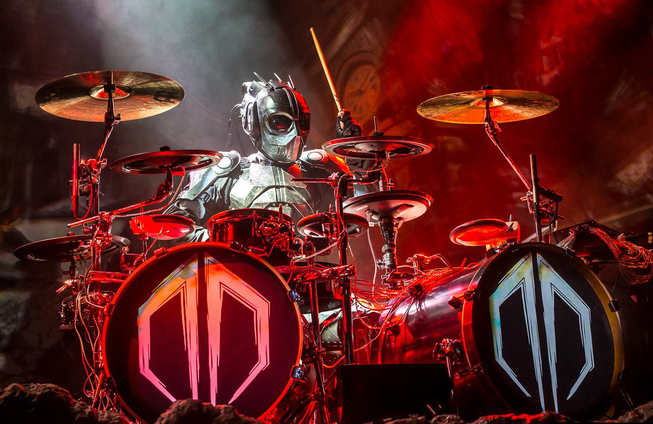 KJ Sawka as Destroid performing in full armor with red dramatic stage lighting