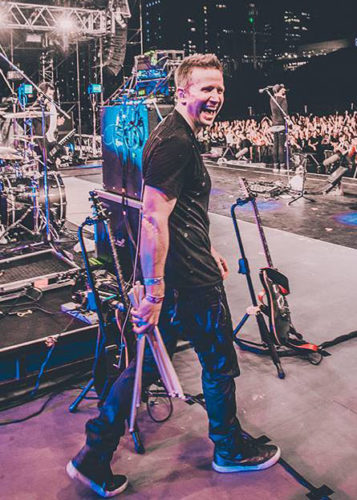 KJ Sawka performing with Pendulum on a major festival stage