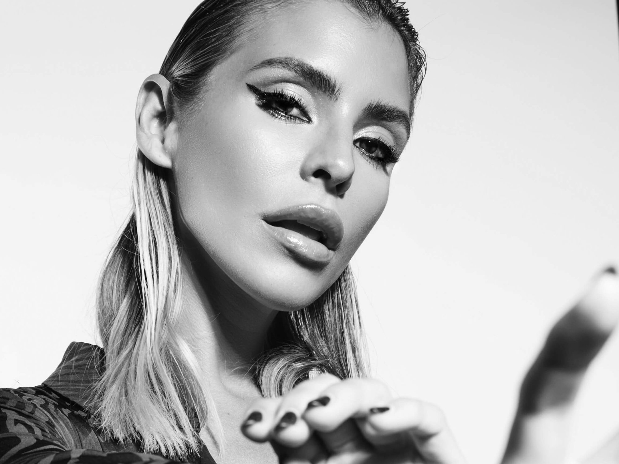 Sam Blacky black and white artist portrait with dramatic eye makeup